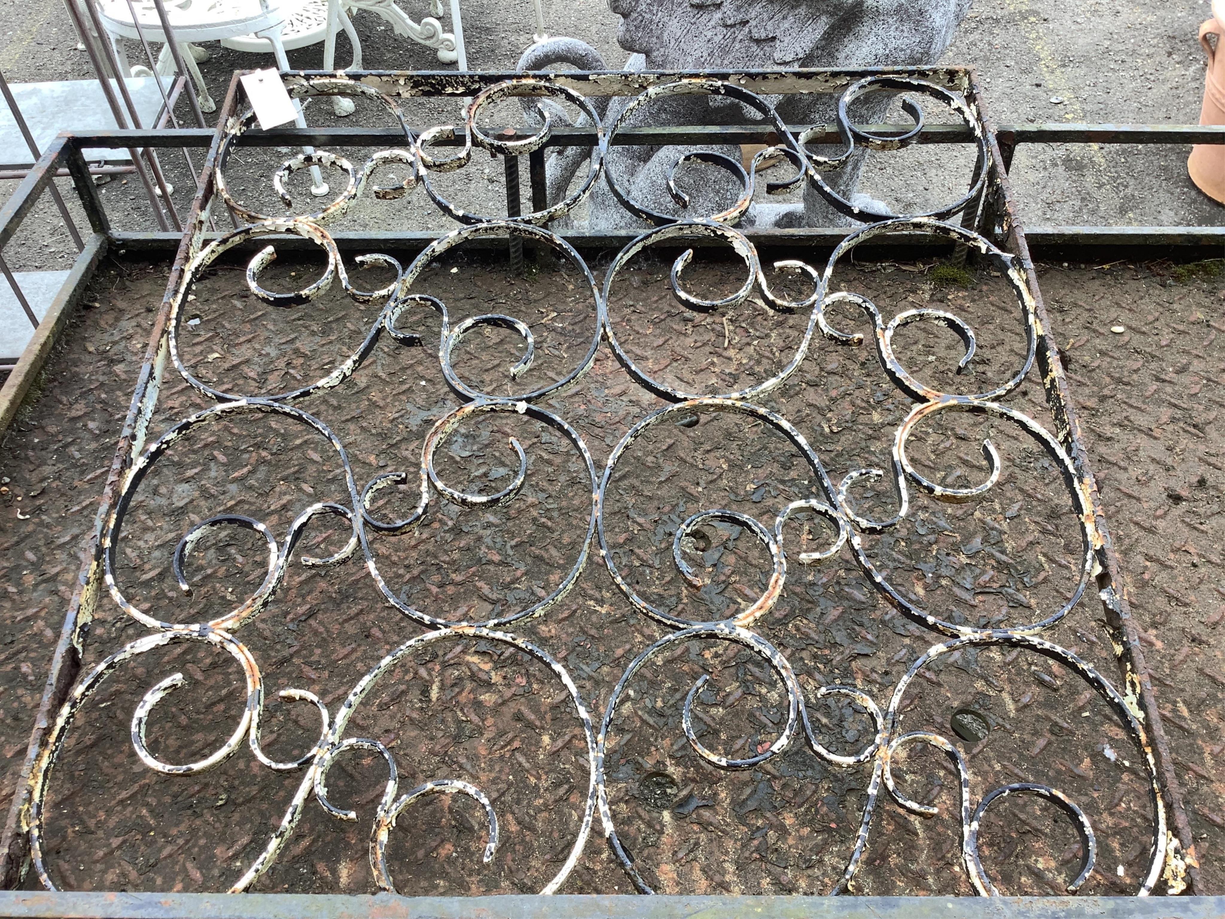 A set of four painted wrought iron rectangular garden panels, width 71cm, height 78cm